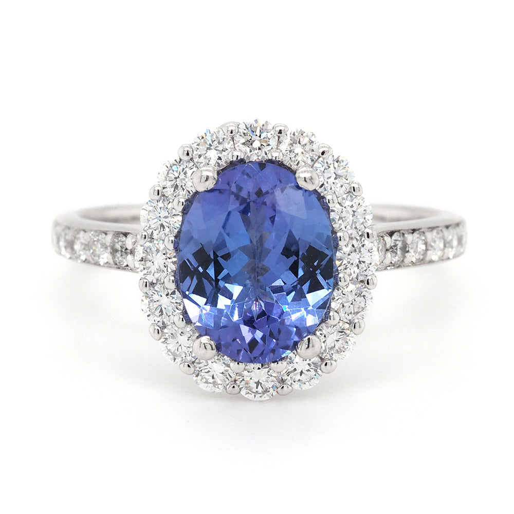 18ct White Gold Oval Tanzanite and Diamond Halo Ring TDW 0.6