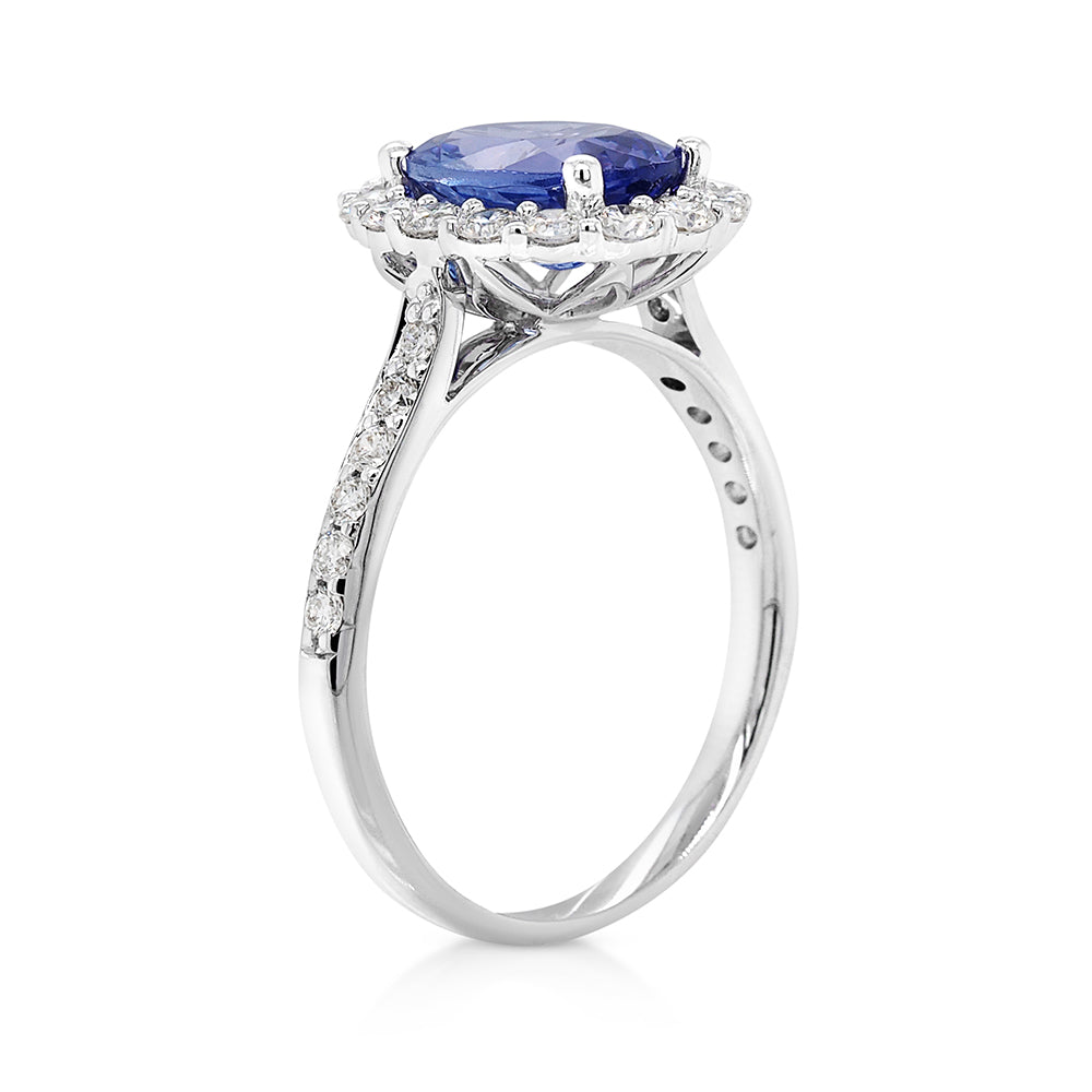 18ct White Gold Oval Tanzanite and Diamond Halo Ring TDW 0.6